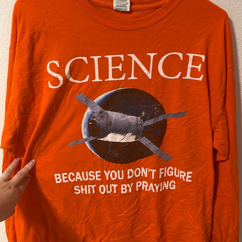 “Science because you don’t figure shit out by praying” graphic long sleeve tee